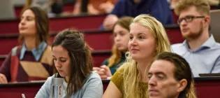 students sit in a lecture theatre at the University of Aberdeen