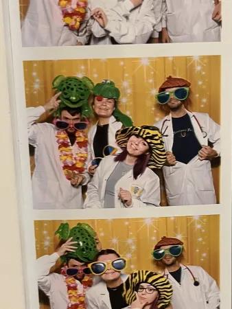 Photo booth set of three photos of students wearing white coats and funny hats and glasses